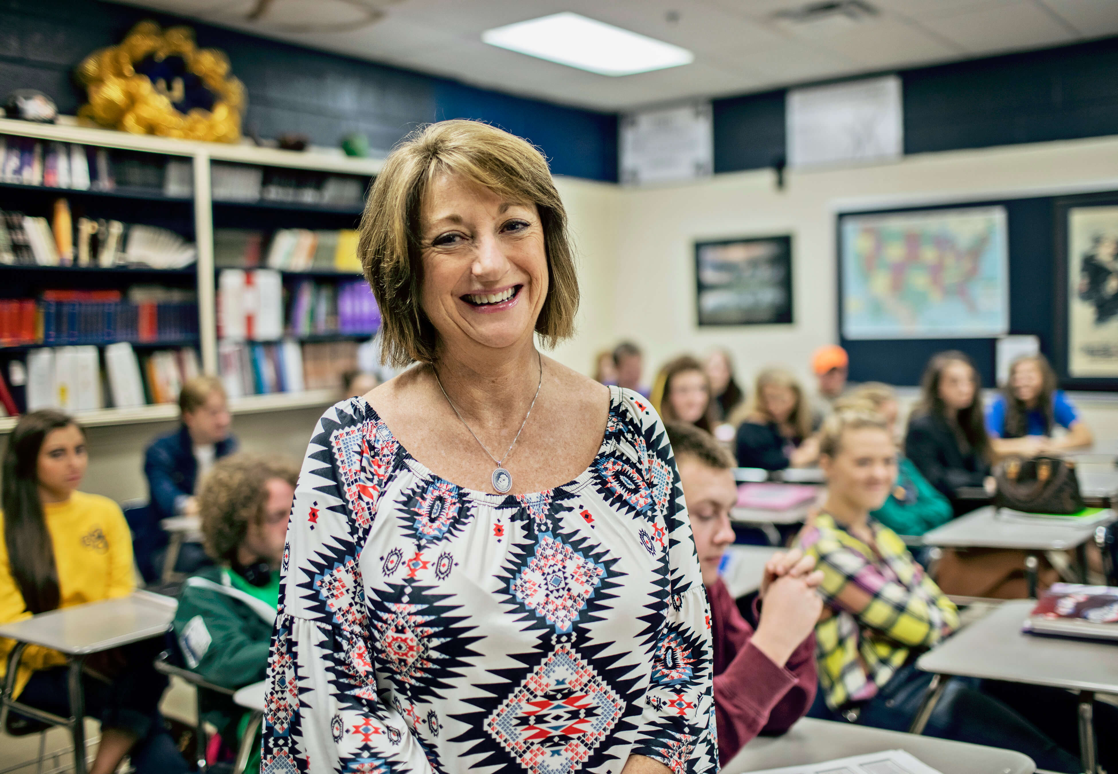 Woman posing in front of a classroom full of students