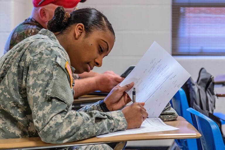 woman in military uniform taking a test