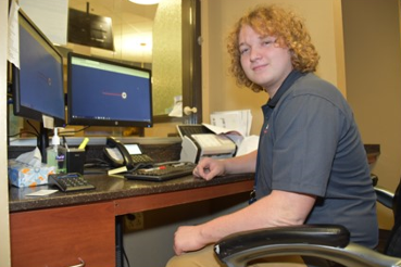 Guy setting in front of computer 