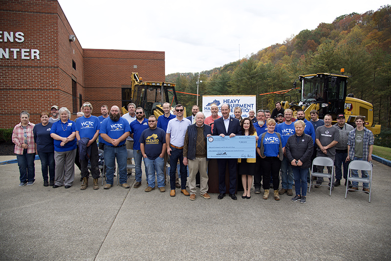 Group holding a check for the grant. 